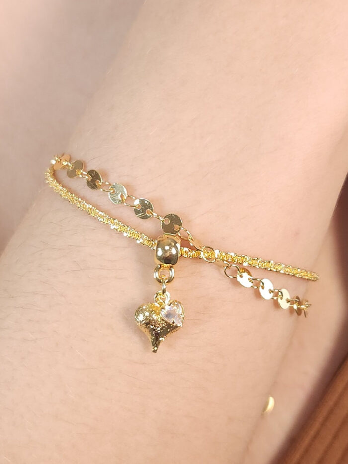 Pulseira dupla com ponto de luz e coração detalhado