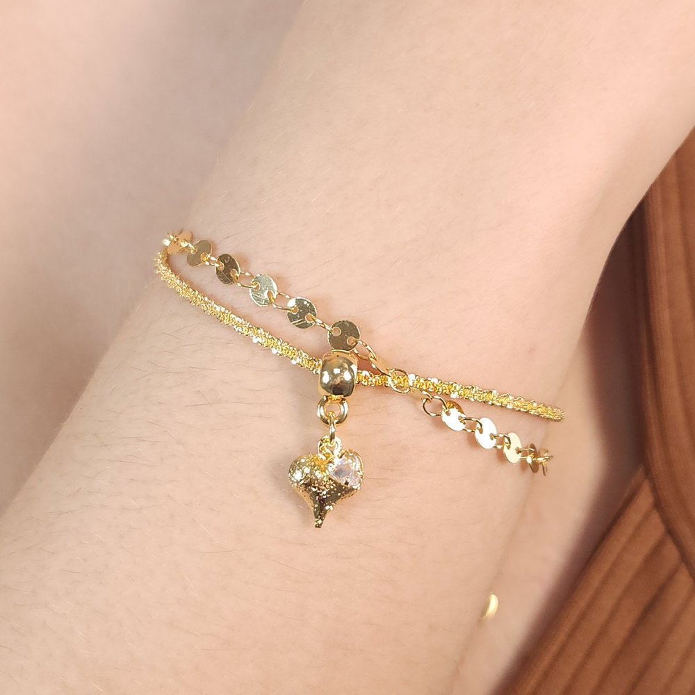 Pulseira dupla com ponto de luz e coração detalhado