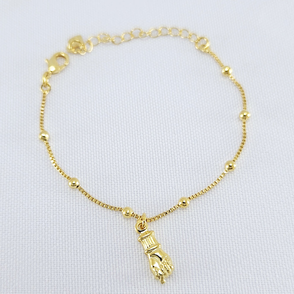 Pulseira infantil com pingente figa dourado