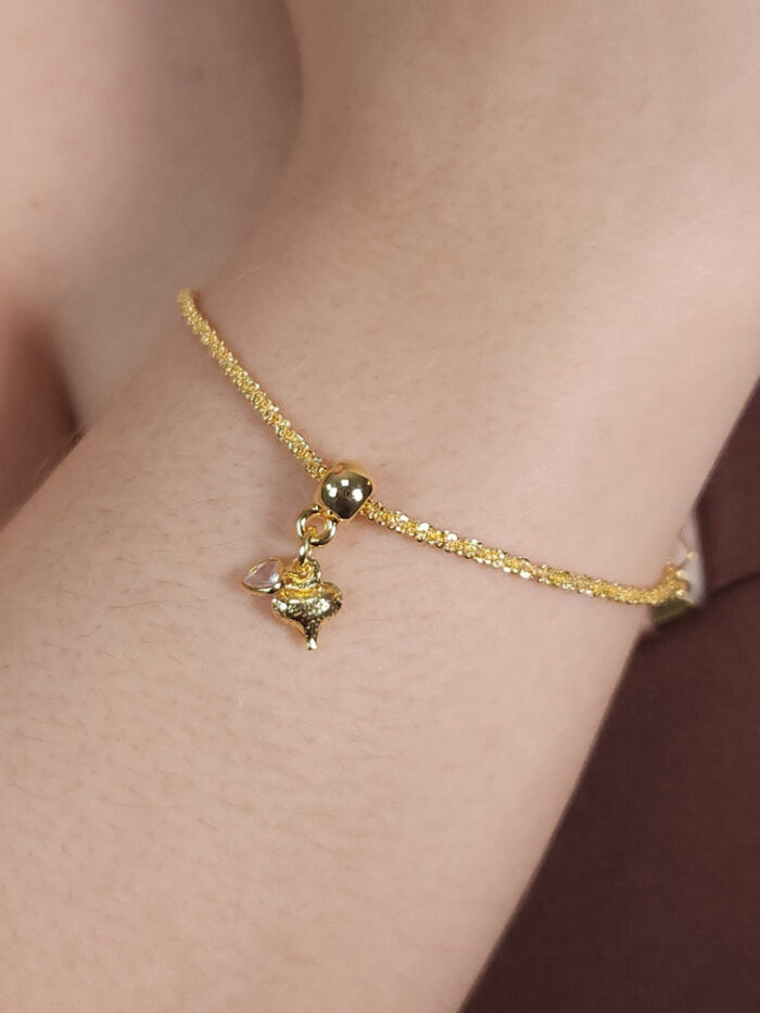 Pulseira detalhada coração pêndulo