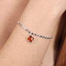 Pulseira trevo marrom  elos redondos