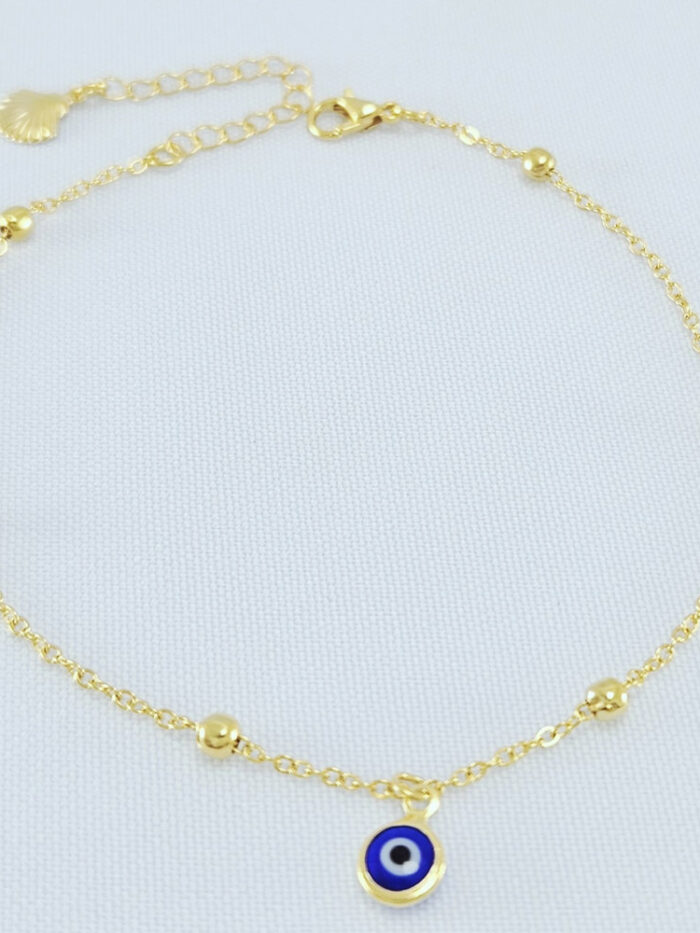Tornozeleira com bolinhas e detalhe olho grego