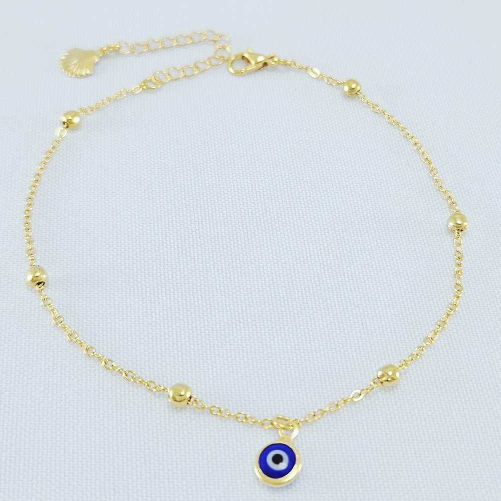 Tornozeleira com bolinhas e detalhe olho grego