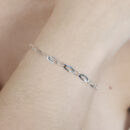 Pulseira elos ovais torcido prateada