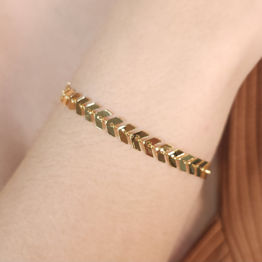 Pulseira setas dourada