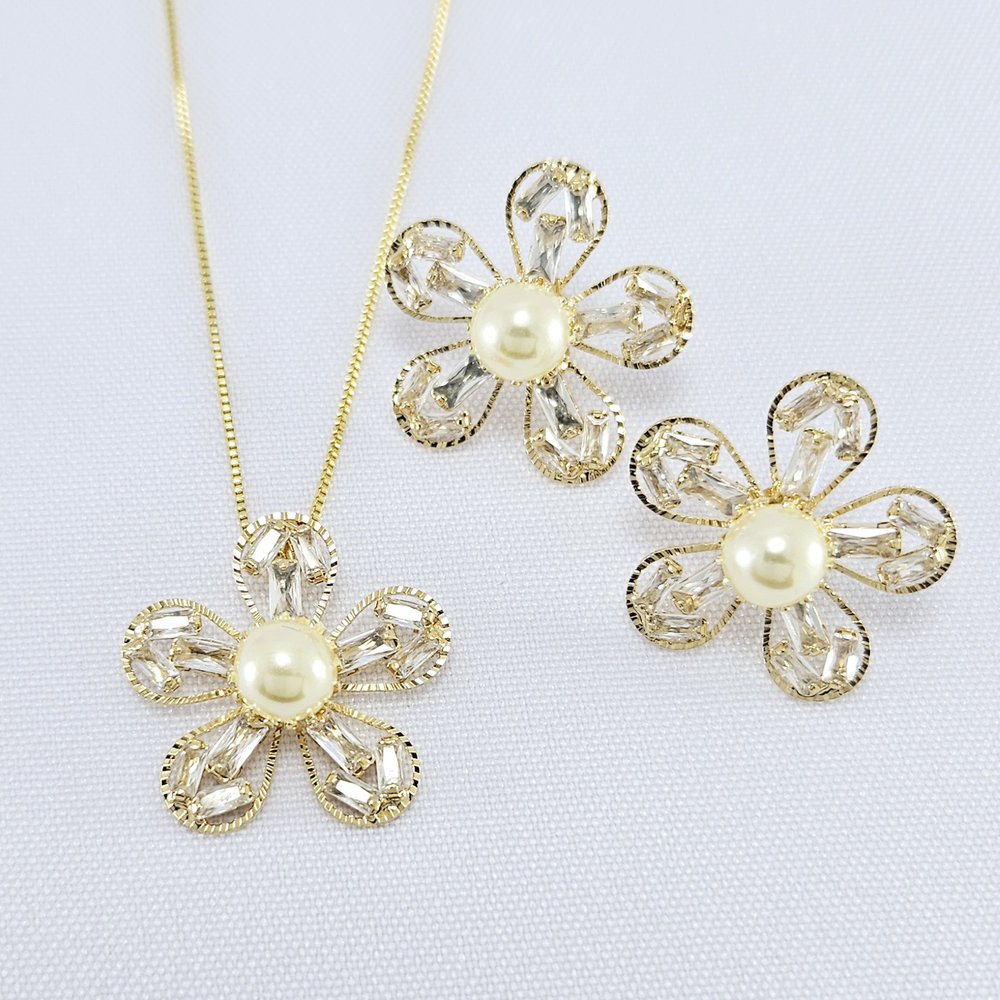 Conjunto flor com pedra navete com pérola central