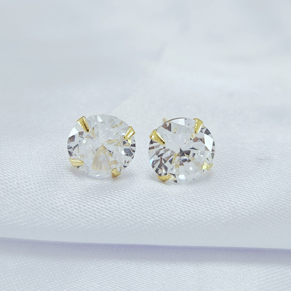 Brinco ponto de luz redondo