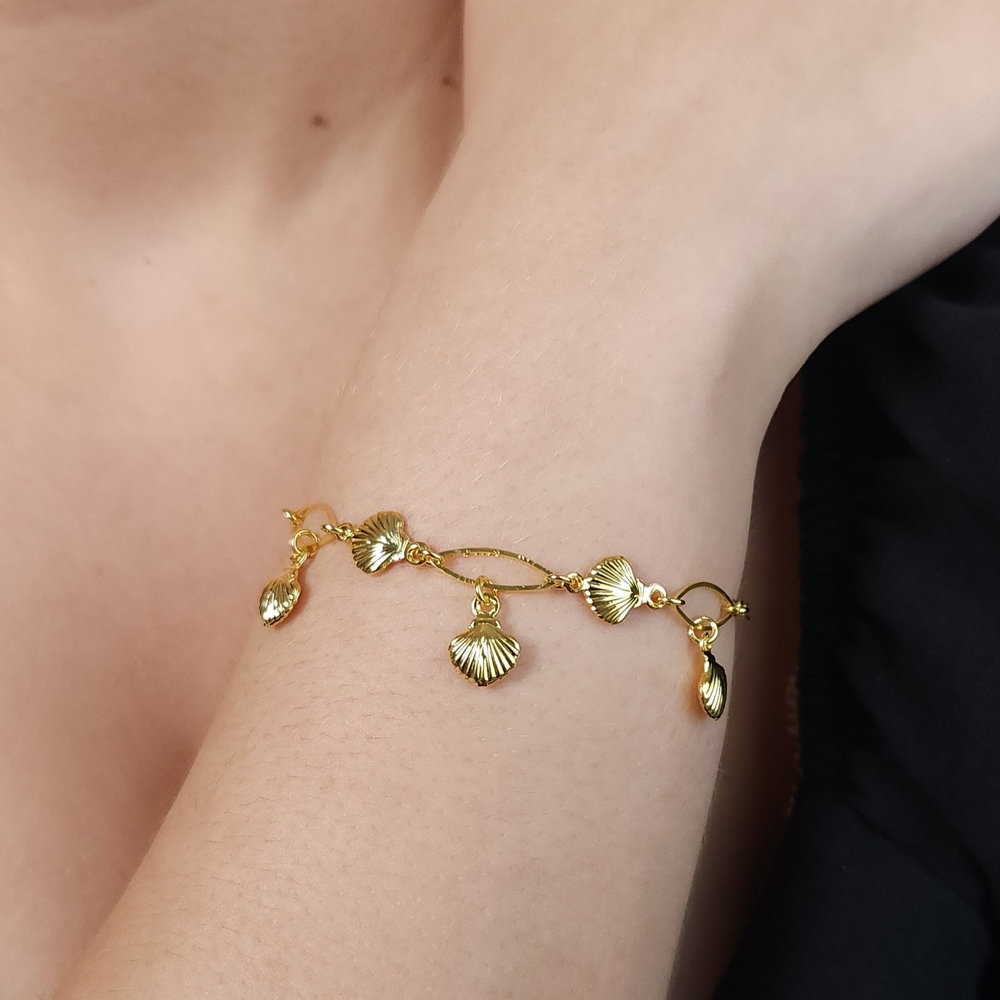 Pulseira elos ovais e navetes com conchas douradas