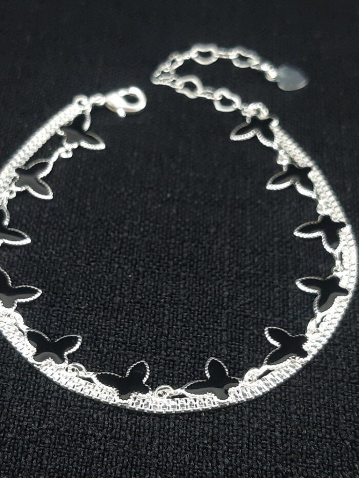Pulseira dupla com borboleta preta esmaltada