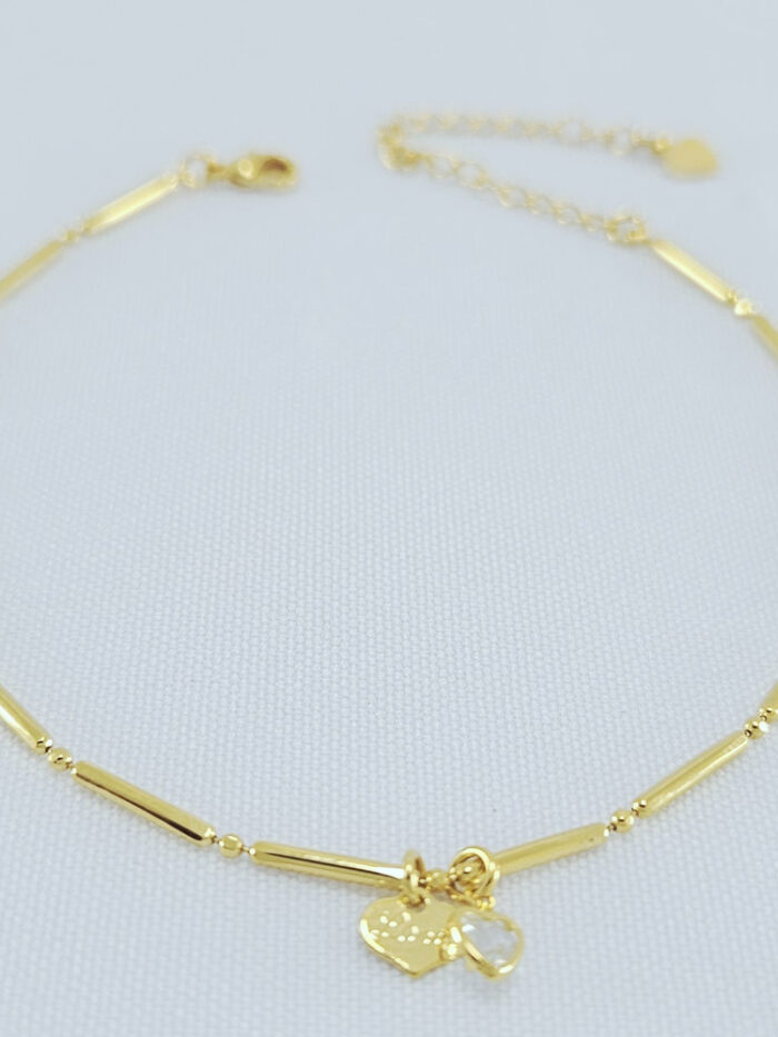 Tornozeleira caninhos dourado com corações pêndulo