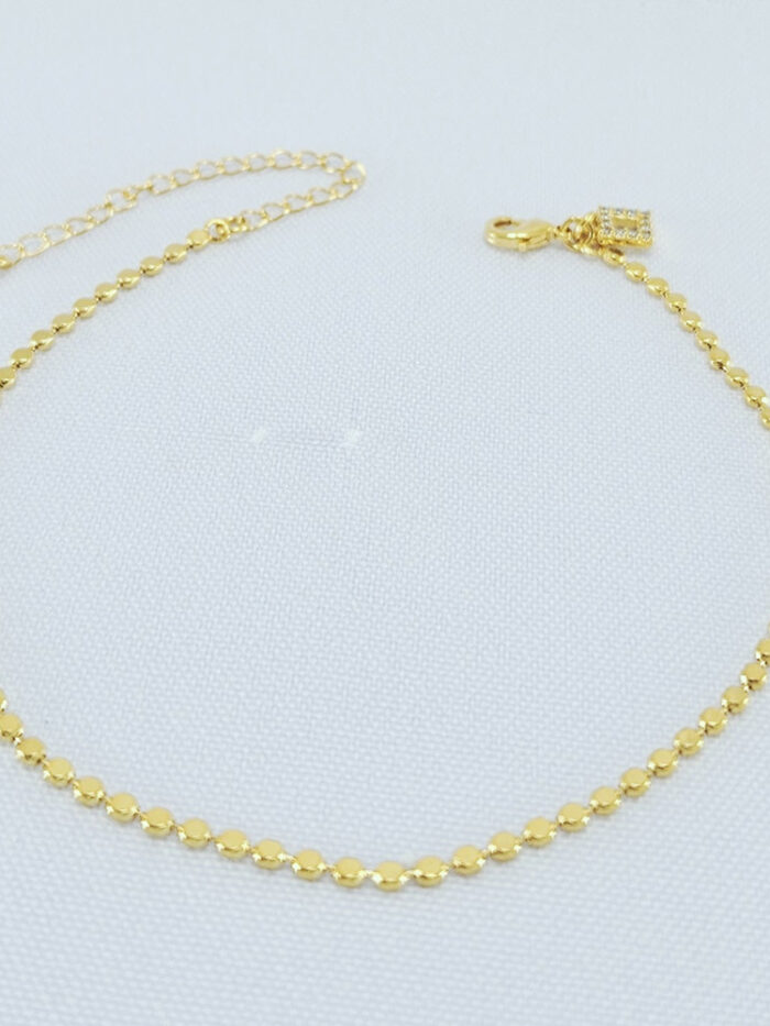 Tornozeleira com bolinhas achadatas