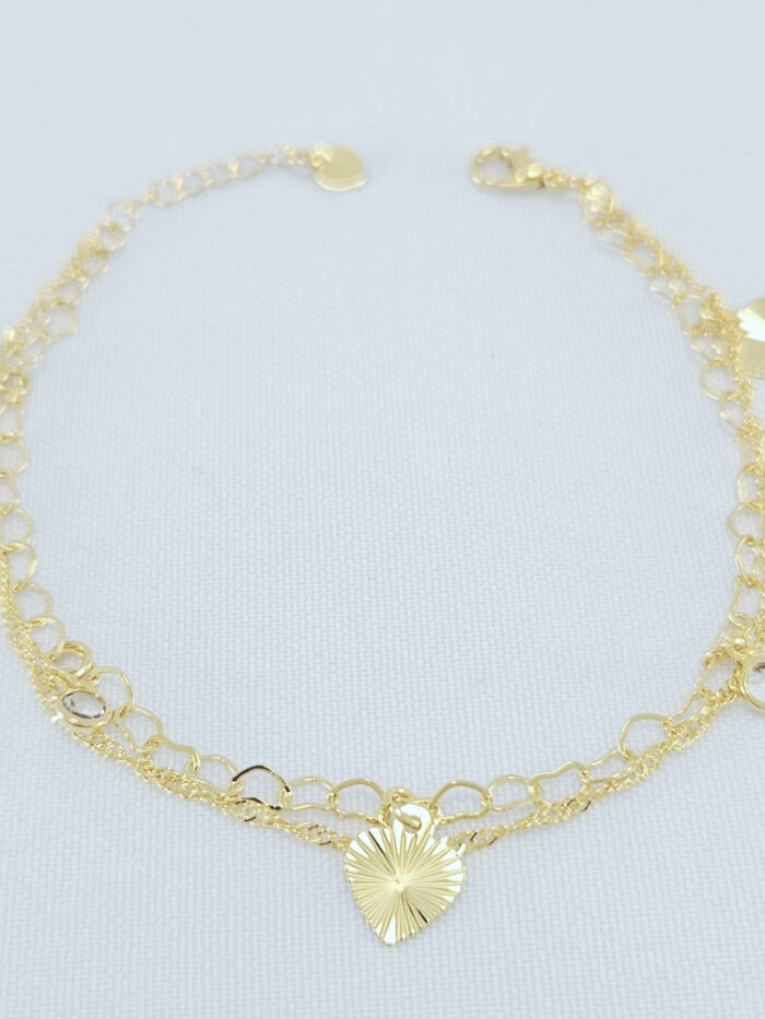 Pulseira dupla com coração detalhado e ponto de luz