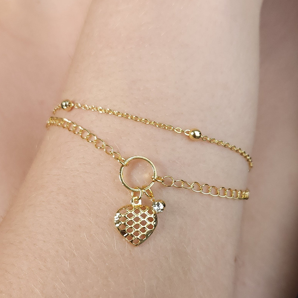 Pulseira dupla com pêndulo coração vazado e ponto de luz