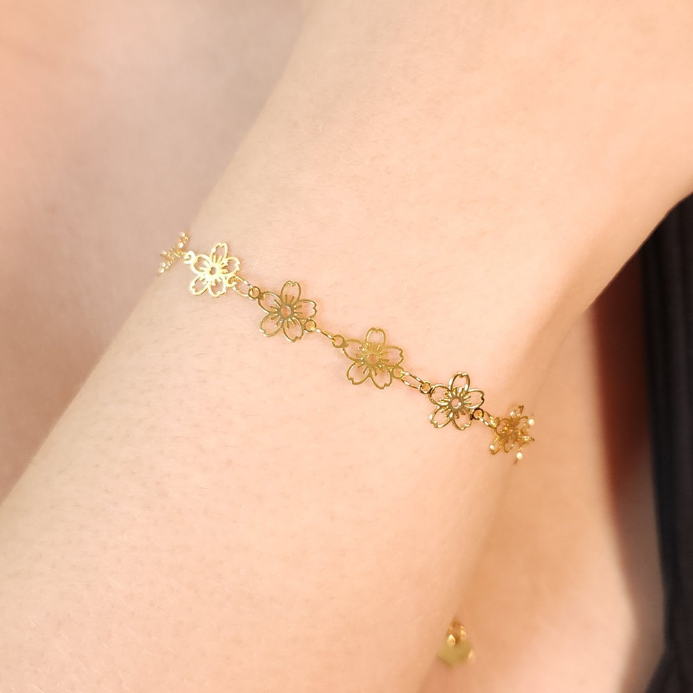 Pulseira flores vazado dourado