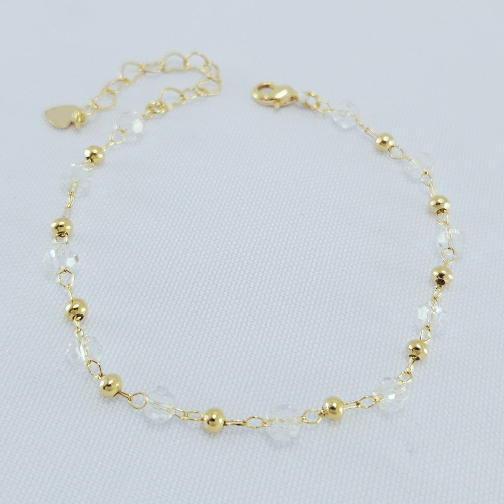 Pulseira com pedras cristal e bolas douradas