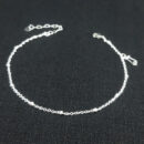 Tornozeleira com elos vazados e pingente figa